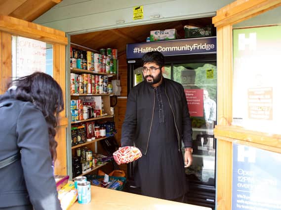 Abid Hussain helping out at the Halifax Community Fridge food bank