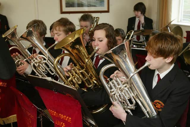The band plays at many community events throughout the year. This picture shows band members playing at the 2008 World Dock Pudding Championships.