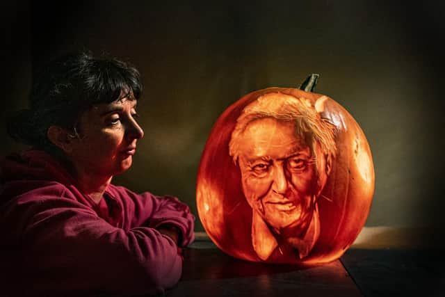 Liz Warrington pumpkin carver at Sand in your Eye with her David Attenborough portrait. Picture Tony Johnson
