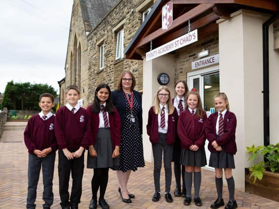Principal Samantha Hirst and some pupils after major renovations at Trinity Academy St Chad’s, Hove Edge, Brighouse. Pictures: Bruce Fitzgerald