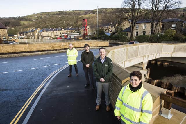 New flood defences on the River Calder at Mytholmroyd. On the new, wider bridge, from the left, VBA senior project manager Chris Blenkarn, councillor Scott Patient, Environment Agency senior advisor Paul Swales and Katie Kimber from Mytholmroyd Flood Wardens.