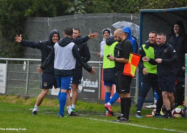 Manager Craig Rouse (left) celebrates with his staff on the sidelines as Pontefract Collieries beat Handsworth 6-0 in the third qualifying round of the Emirates FA Cup. Piucture: @dribblingcode