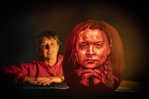 Liz Warrington pumpkin carver at Sand in your Eye looks at the portrait of Greta Thunberg by the company.