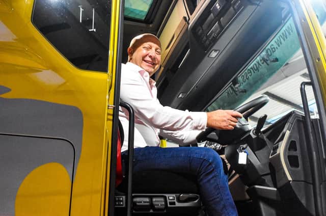 Owner and Managing Director of A.D.D. Express, David Fairbrother, pictured sitting in one of the lorries,