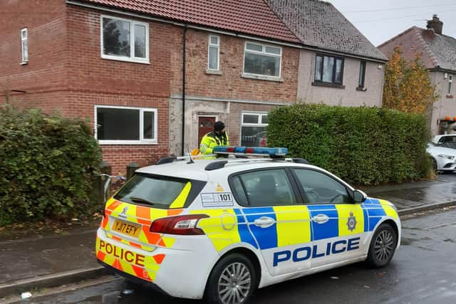 Police in Lightcliffe after a woman's body was found