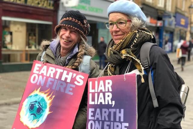 Campaigners were raising awareness of the climate change crisis. Photo by Helen Blagg