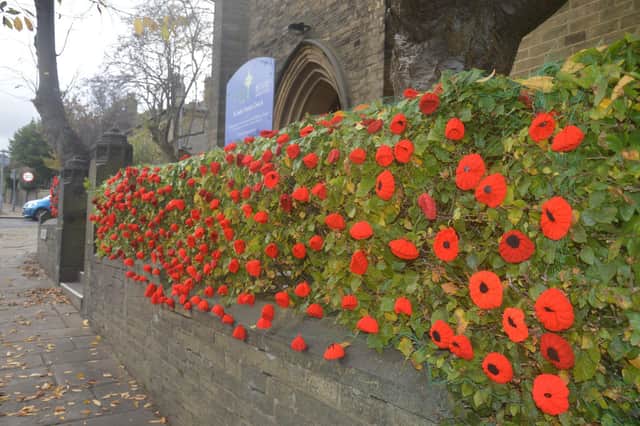 Knitted poppies outside St Jude's Church, Savile Park, Halifax. Photo: Richard Constantine.