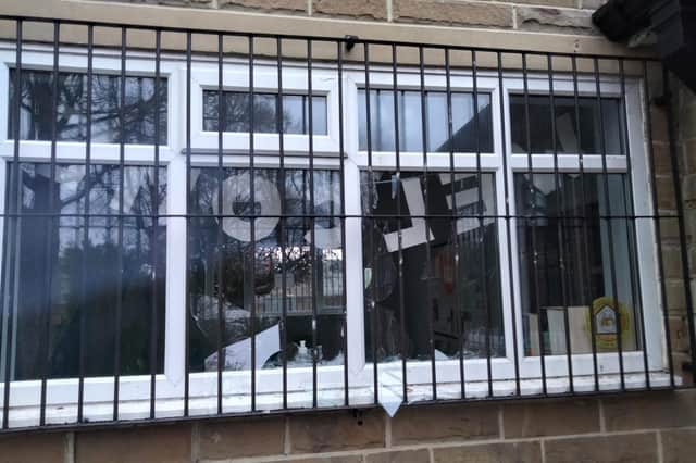 The smashed windows at St Augustine's Centre in Halifax