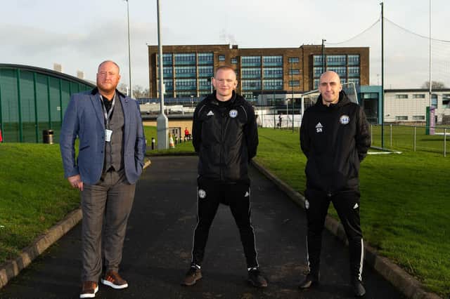 Craig Waterworth, of Calderdale College, with Town boss Pete Wild and head of youth development Steve Nichol