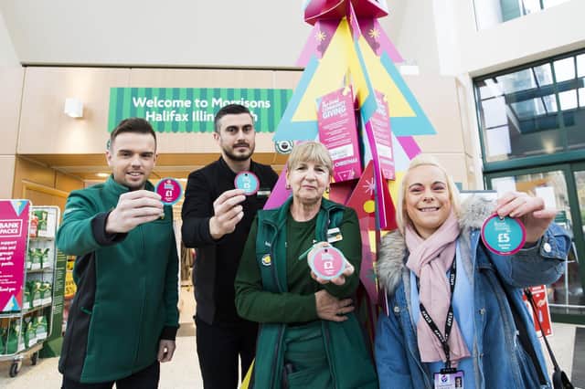 Community coach Dan Kelly, Store Manager Danny Dyer and Community Champion Julie Baimbridge from Morrisons in Illingworth with Kim Shedden from Mothershare.