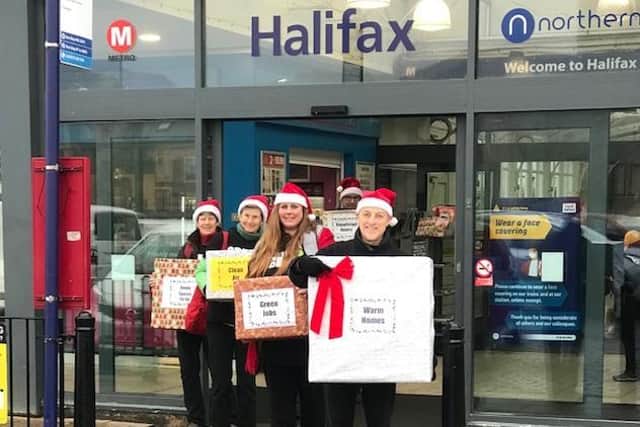 The Calderdale Green New Deal campaigners arrive at Halifax railway station.