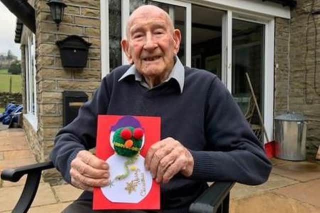 Arthur Butler, aged 100 receiving his Santa-gram from Home Instead.