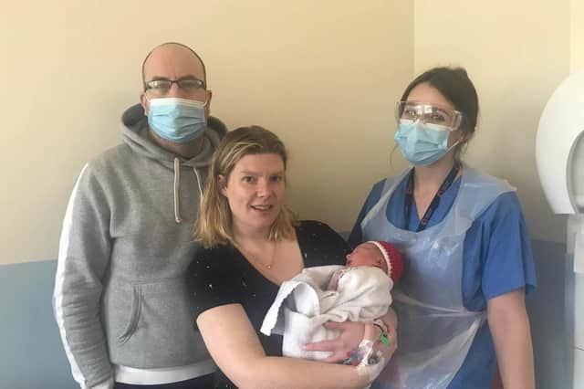 Christmas Day baby Freddie O'Leary with parents David and Amy and midwife Hannah
