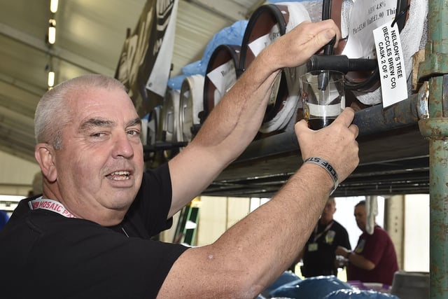 Peterborough Beer Festival 2019 at the Embankment.  Serving the first pint  Ian Thorn EMN-190820-175802009