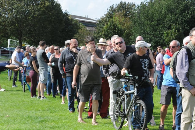 Peterborough Beer Festival 2019 at the Embankment.  Visitors queuing to get in EMN-190820-180004009