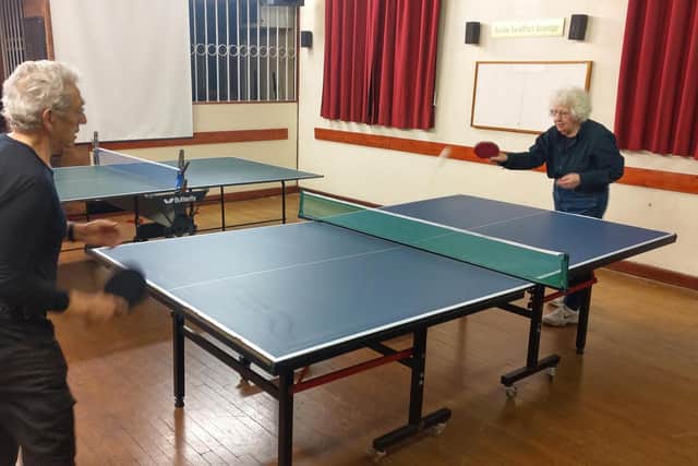Having a game of table tennis