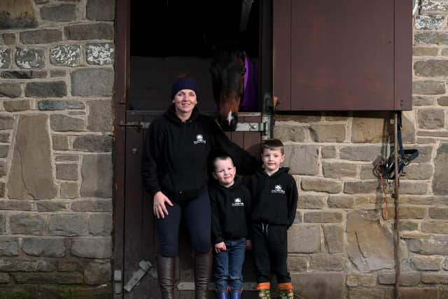 Calderdale milkwoman Debbie Ogden pictured with her sons George and Eric
