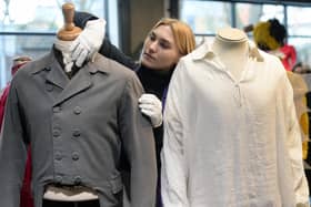 The infamous wet shirt (right) as worn by Colin Firth in Pride and Prejudice on display at the "Lights Camera Auction" photocall at Kerry Taylor Auctions. (Photo by Eamonn M. McCormack/Getty Images)