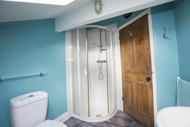 A shower room serves two bedrooms on the top floor.