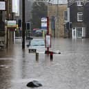 Flooding in Hebden Bridge, with Albert Street and New Road under water.