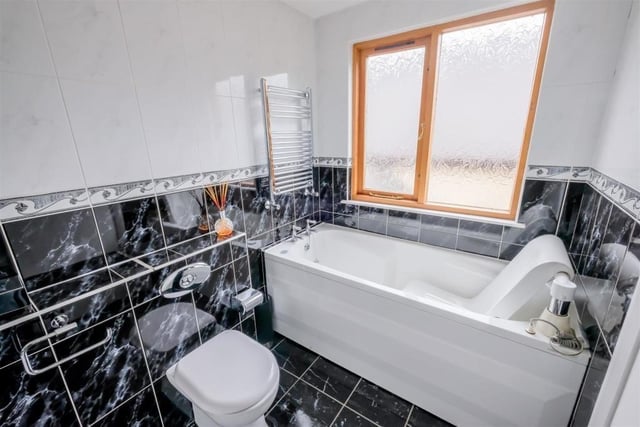 The bath feature within the first floor en suite bathroom.