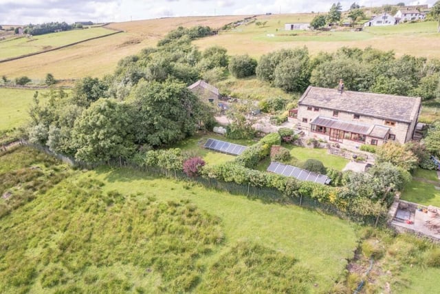 An aerial view of the farmhouse and its surroundings.