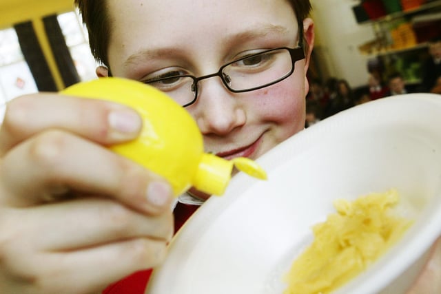 Pancake day at All Saints CE Primary School, Halifax in 2009. James Wood, 11, tucks into a pancake
