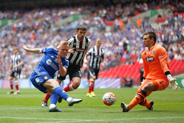 LONDON, ENGLAND - MAY 22:  Jordan Burrow of FC Halifax Town fires a shot at James McKeown of Grimsby Town during the FA Trophy Final match between Grimsby Town FC v FC Halifax Town at Wembley Stadium on May 22, 2016 in London, England.  (Photo by Joel Ford/Getty Images)