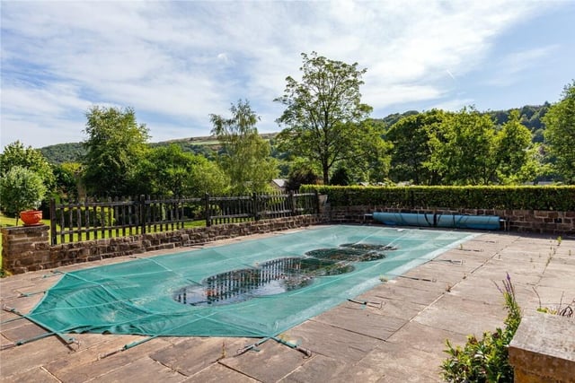The front south facing terrace steps lead down to a refreshing swimming pool and there is also an adjacent shower room.