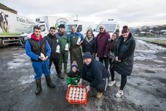 100 years of H Southwell and Son dairy at Shroggs Farm - Leon Parrott, Reuben Sykes, Liam Dodson, Karl Fairbank, Bronwyn Kershaw, Stephen Kershaw, Harriet Sykes, and Sarah Sykes, with Hugo Sykes, six, and Chris Sykes at the front.