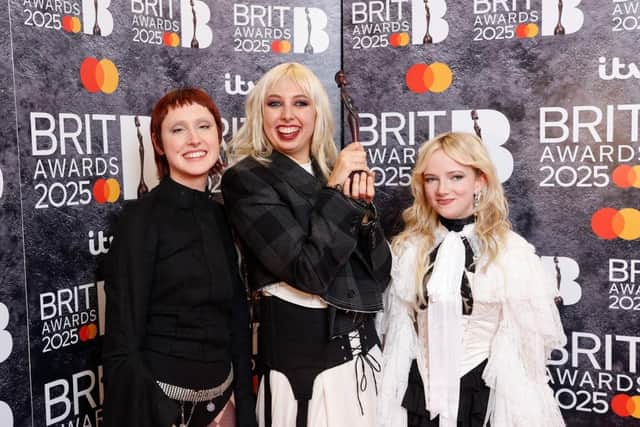 Lizzie Mayland, Georgia Davies and Emily Roberts of The Last Dinner Party during The Brit Awards 2025