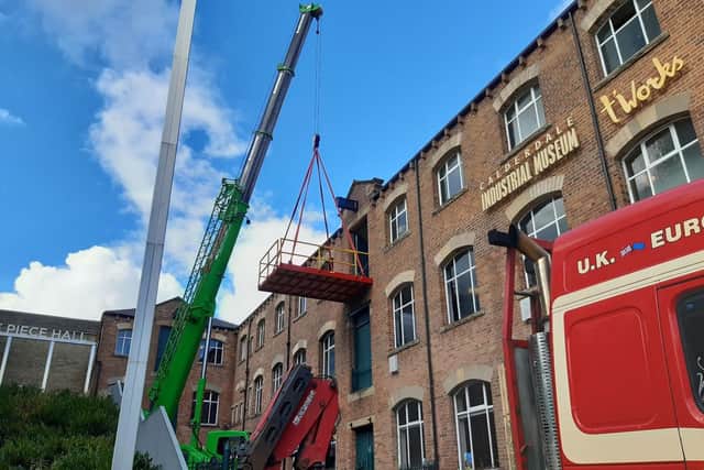 Crane lifts machinery into Calderdale Industrial Museum