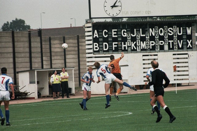 Steve Bull is challenged by Town's Dave Robinson, August 22, 1987