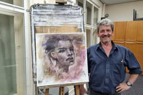 Anthony Barrow with his charcoal and acrylic painting