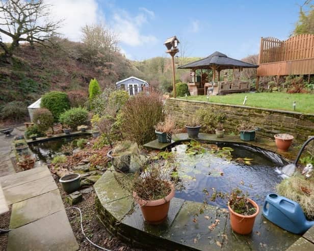 Stunning landscaped gardens come with this semi-rural home in Shelf.