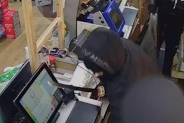 Police have released a video of on of the terrifying sword-point robberies