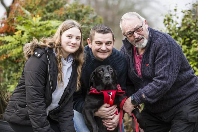 Bella the dog reunited with owner Allan Hough, right, joined by Allan's son, Lee, centre, and granddaughter Isabelle.