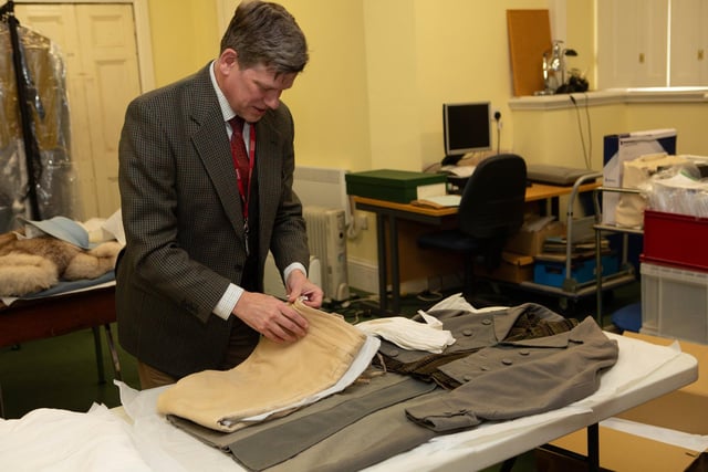 Museum manager Richard MacFarlane with clothing worn by Colin Firth, Mr Darcy in Pride and Prejudice