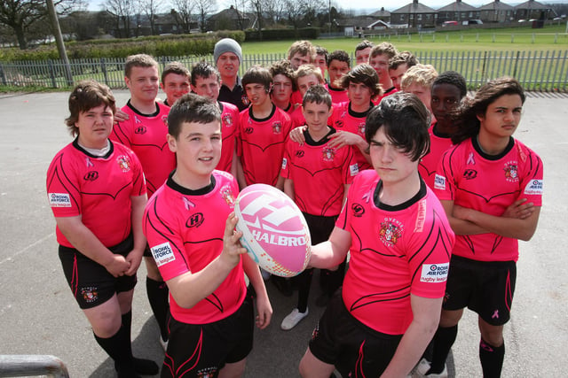 Cameron Regan and Jay Farrell with the Ovenden under 15 rugby team who played two matchs in new pink kit to raise money for Breast Cancer Care in 2009