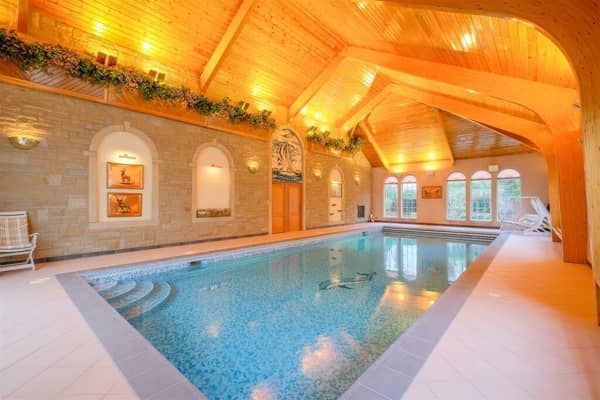 The property's stunning indoor swimming pool, that has adjoining changing rooms and conservatory.