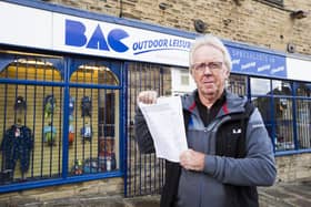 David Jackson at BAC Outdoor Leisure, Elland, with one of the petitions in shops across Elland