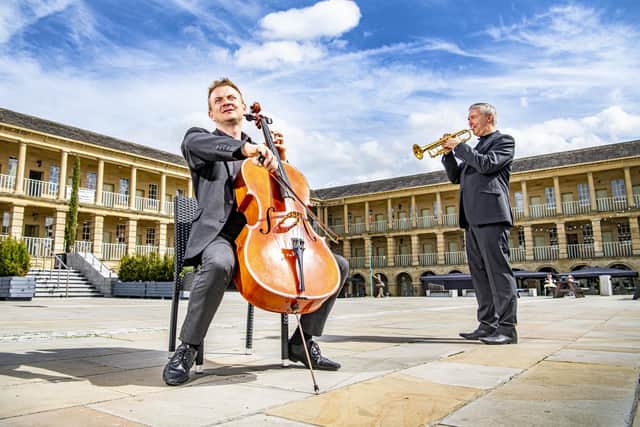Cellist Ben Crick and trumpet player Anthony Thompson of the Yorkshire Symphony Orchestra  at The Piece Hall in Halifax