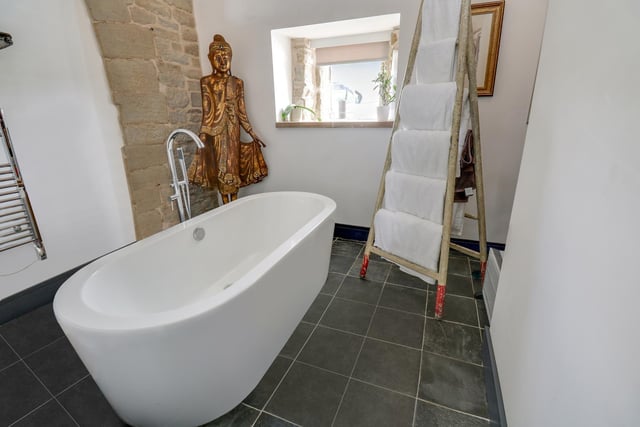 One room has a free standing bath as a feature.