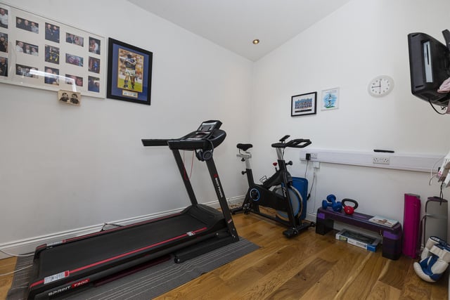 A versatile room on the ground floor that is currently used as a gymnasium.