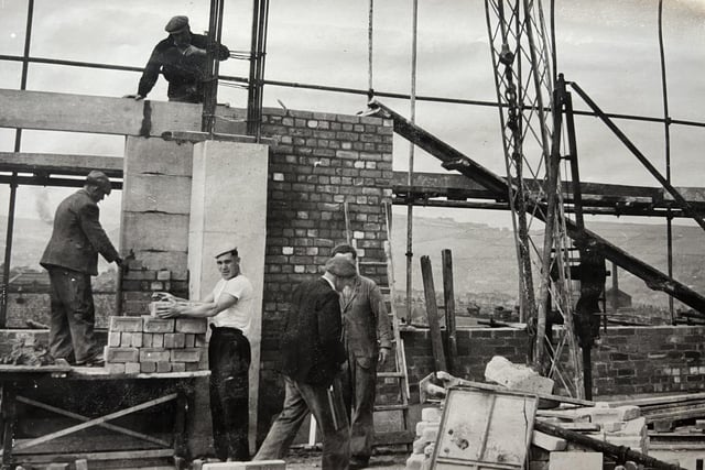 Construction workers on the roof of The Percival Whitley Centre in 1957