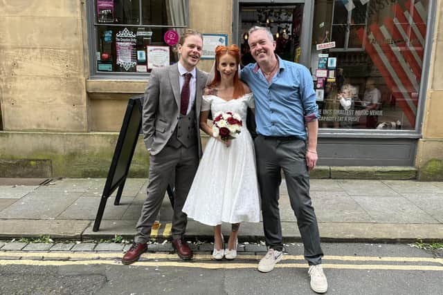 Michael Ainsworth with the happy couple who tied the knot at The Grayston Unity, April Caulfield and Will Stewart