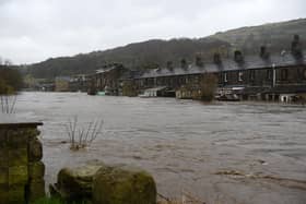 Swamped: Flooded houses in Mytholmroyd on February 9, 2020, after the River Calder burst its banks as Storm Ciara swept over the country. Photo by OLI SCARFF/AFP via Getty Images)