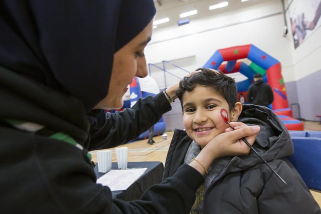 51st Pellon Scouts - Iftar Under the Stars at Halifax Academy. Subhan Hussain, seven, has his face painted by Myrah Nadeem.