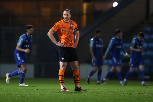 HALIFAX, ENGLAND - MARCH 20: Jamie Grimes of Chesterfield looks dejected after the FC Halifax Town third goal during the Vanarama National League match between FC Halifax Town and Chesterfield at The Shay on March 20, 2024 in Halifax, England.  (Photo by George Wood/Getty Images)