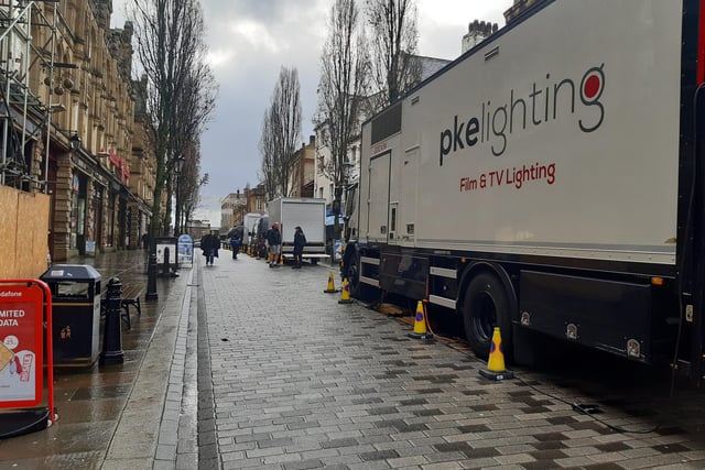 Filming trucks have been parked up along Corn Market